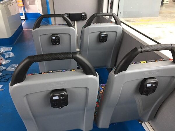 Bus seats with hearing devices on the back of the chair