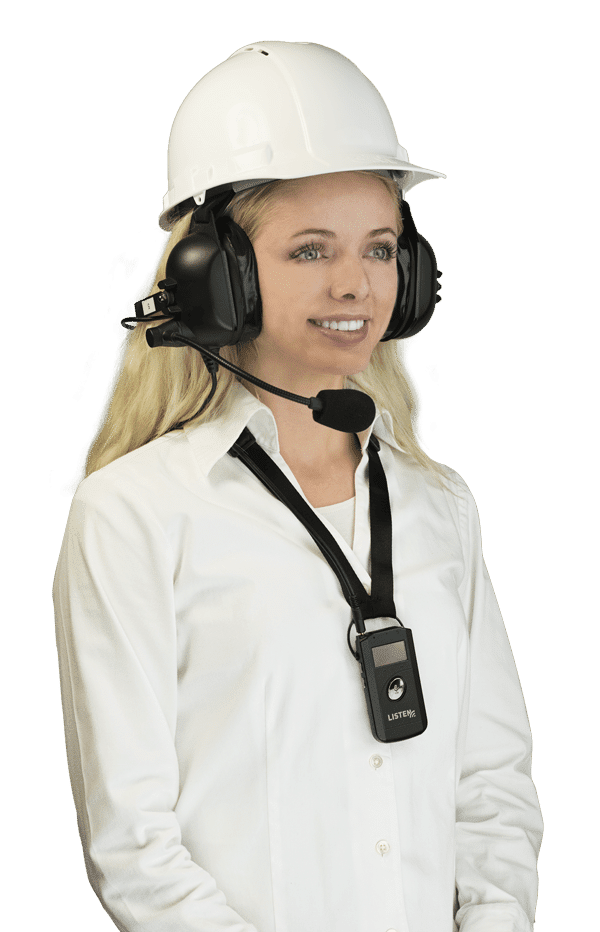 Young blonde woman wearing a white button-down shirt, smiling and wearing an over-ears industrial headset (for ListenTALK) with a white hard hat