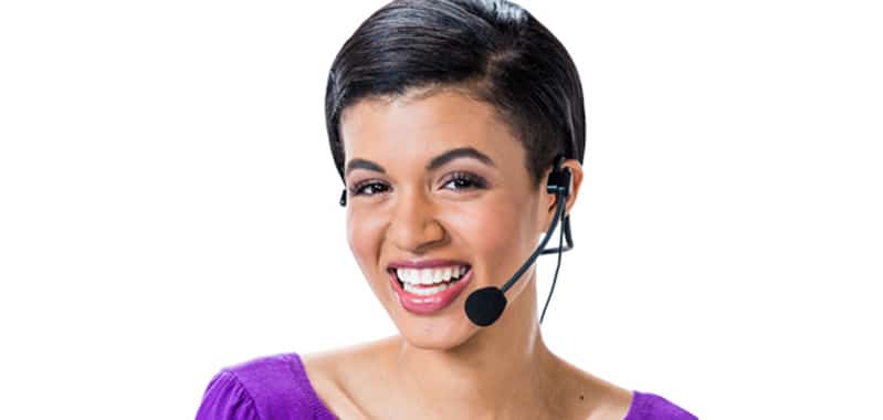 A female wearing a headset with a microphone looking directly at us.